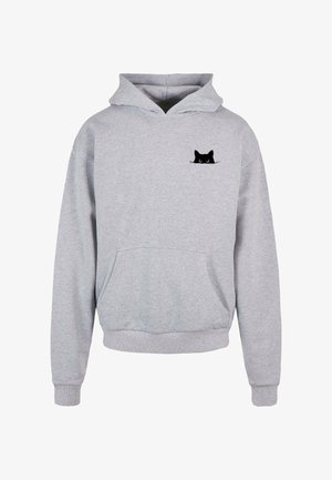 Grå hettegenser laget av bomullsblanding, med en frontlomme og et lite svart kattetrykk på brystet. Myk tekstur, avslappet passform.