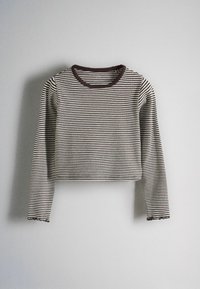 Long-sleeve cropped shirt with narrow black and white horizontal stripes and a dark round neckline on a gray background.