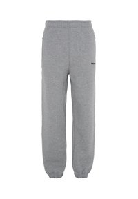 Šedé tepláky s volným střihem, elastickým pasem a manžetami na kotnících. Obsahují boční kapsy na zip a malé černé logo.