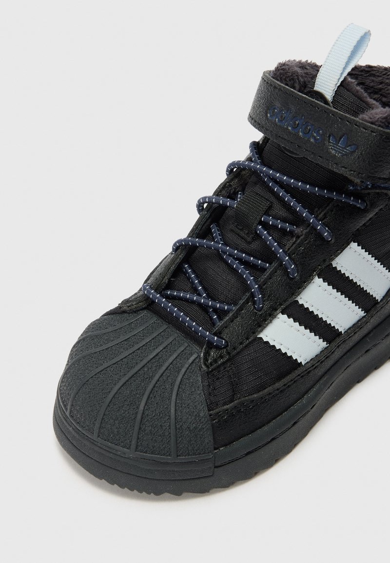 adidas Originals SUPERSTAR TREK UNISEX - Winter boots - core black/halo  blue/carbon/anthracite - Zalando.ie
