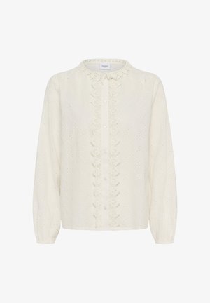 Krém színű hosszú ujjú blúz finom kivágásmintával, csipkés díszítéssel a gombolósáv mentén és hullámos, kerek nyakvonallal.
