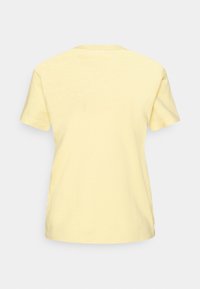 Round-neck, short-sleeved T-shirt in soft, light yellow cotton. Solid color with no patterns or graphics. Simple, casual design.