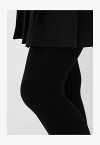 Unselected, black ribbed