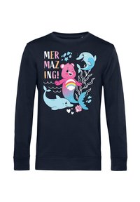 Felpa blu navy con un vivace design da cartone animato che presenta una sirena orsa rosa, delfini, corallo e la scritta "MERMAZING!" in caratteri giocosi.