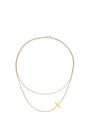Guldmetal halskæde med to lagkæder. Den ene kæde har et mat korsvedhæng. Glat tekstur og minimalistisk design.