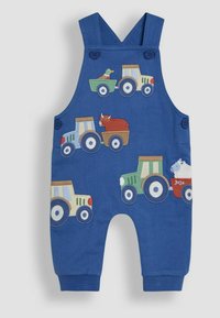 Salopette en coton bleu avec des tractors et des animaux brodés sur le thème de la ferme. Comprend des boutons sur les bretelles et des poignets côtelés.