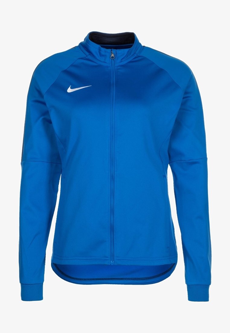Veste de sport bleue à manches longues avec fermeture éclair intégrale devant et logo blanc Nike swoosh sur la poitrine, dotée d'un col montant et d'une coupe ajustée.