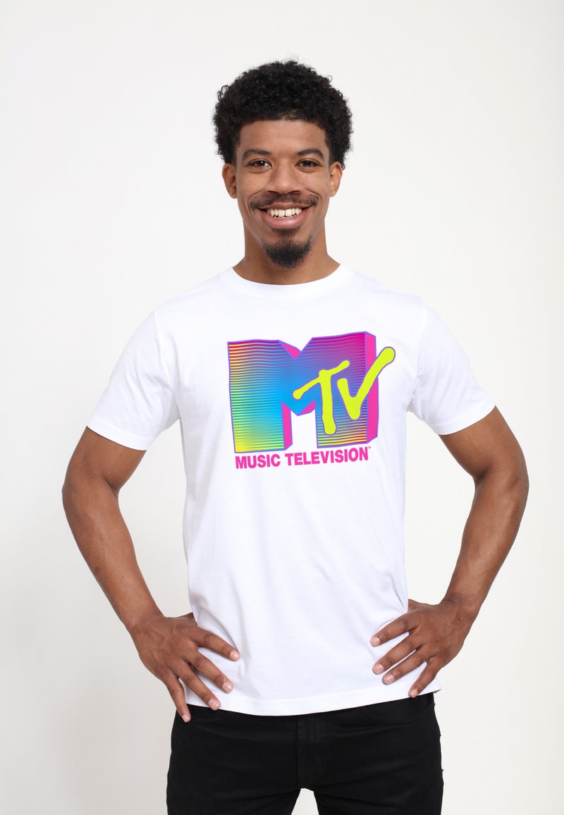 White cotton t-shirt featuring a colorful MTV logo with gradient stripes in blue, pink, and green, along with “MUSIC TELEVISION” text in pink.