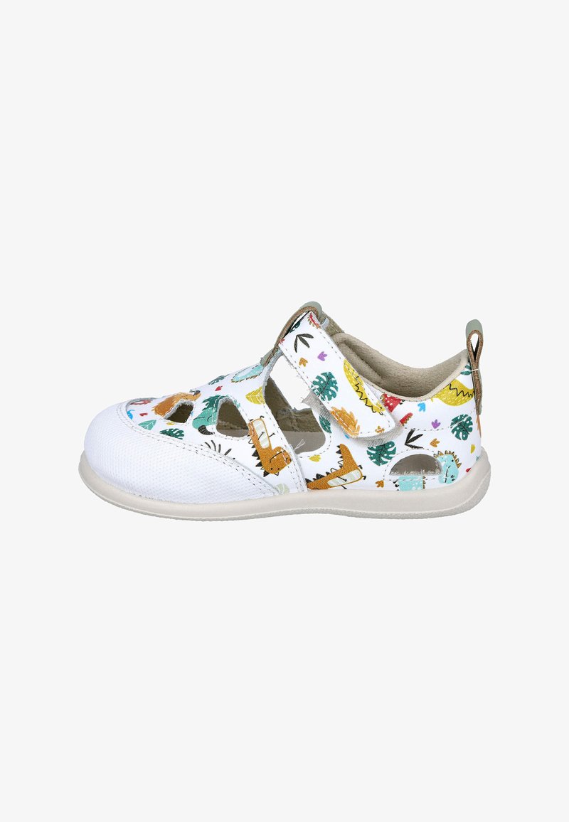Sandalia blanca para niños con dibujos de dinosaurios y hojas, lados recortados, tira de velcro e interior acolchado beige.