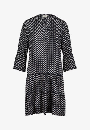 Marineblaues knielanges Kleid mit weißen Polka-Dots, dreiviertel Glockenärmeln, V-Ausschnitt und mehrstufigem Rock.