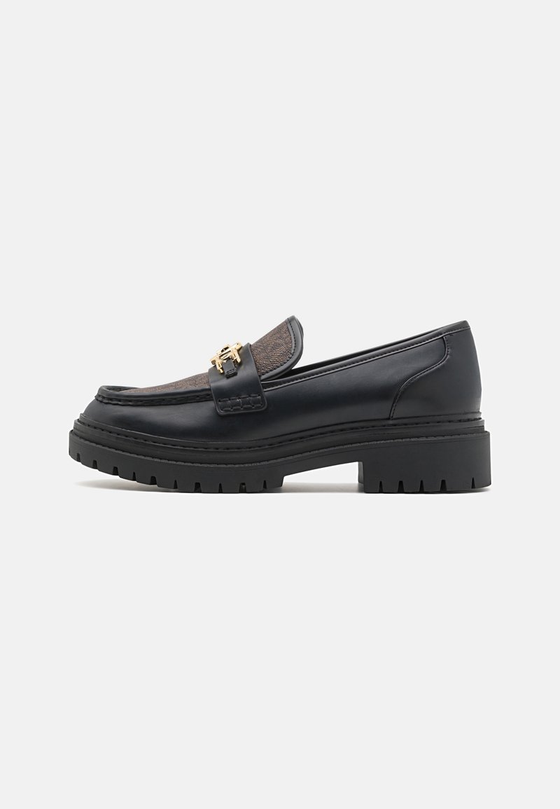 Black leather loafer with a textured brown panel and gold hardware accent. Features a thick, patterned rubber sole for traction.
