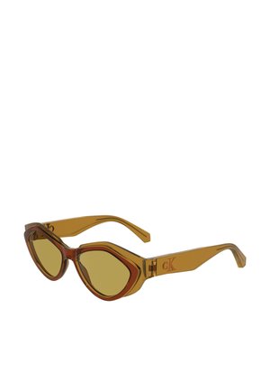Brown and amber plastic sunglasses with an angular cat-eye shape, yellow lenses, and subtle branding on the temple. Transparent frames enhance design.