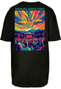 Black t-shirt featuring a colorful graphic of a concert scene with mountains, vibrant rays, and the text "DANCING UNDER STARS" at the top.