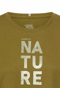 Olive green cotton t-shirt featuring a round neck and printed text "EMPOWERED BY NATURE" in metallic silver, with a soft texture.