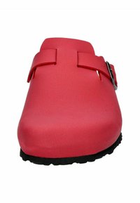 Red, plastic clogs with a rounded toe, featuring two adjustable straps and a silver buckle. Black rubber sole with textured grip.