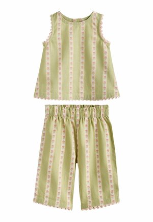 Ärmelloses hellgrünes Oberteil und passende Shorts mit elastischem Bund, vertikalen rosa Blumenstreifen und gewellten Abschlüssen.