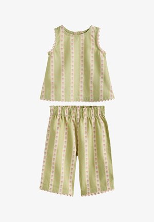 Haut sans manches vert clair et short assorti à taille élastique avec des rayures florales verticales roses et des bords festonnés.