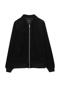 Giacca in cord di colore nero con zip frontale, colletto a punta, orlo elasticizzato e tasche laterali; presenta un tessuto testurizzato e una vestibilità comoda.