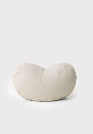 Cream-colored, bean-shaped pillow with a textured fabric cover and seam detailing around the edges. Soft and plush appearance.