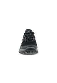 Black athletic shoes with a suede-textured upper, featuring a padded collar, sturdy laces, and a durable rubber outsole with traction patterns.