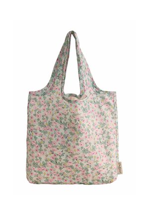 Bolsa de tela reutilizable con estampado floral en rosa y amarillo, con hojas verdes suaves y etiqueta de marca adjunta en el lateral.