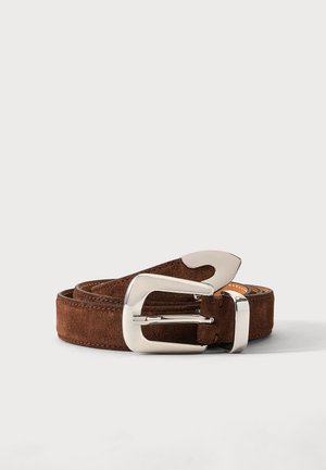 Brown suede belt with large shiny silver buckle, rolled up on a plain light background.
