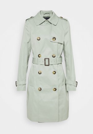 Lichtgroene trenchcoat tot op de knie met dubbelrijige knopen, tailleband, schouderepauletten en verstelbare polsbandjes.