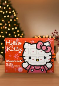 Hello Kitty-themed sock advent calendar features an orange background with a large Hello Kitty illustration, displaying numbered doors for 12 pairs.