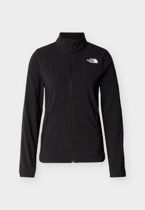 Black zip-up softshell jacket with high collar, long sleeves, side zip pockets, and white The North Face logo on chest.