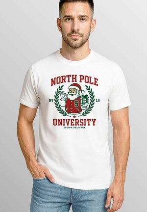 White cotton t-shirt featuring a festive design with "NORTH POLE UNIVERSITY," a cartoon Santa, and green laurel accents.