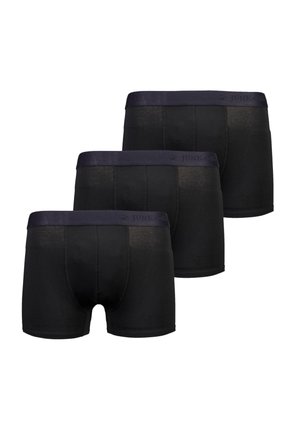 Zwarte boxershorts in een verpakking van drie. Zachte stof met een gladde tailleband waarop het logo "JUNK de LUXE" staat. Middenhoogte pasvorm.