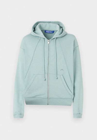 Mintgrønn zip-up hettegenser med snorhette, frontlommer, ribbede mansjetter og kant, samt liten logo-detalj på venstre side.
