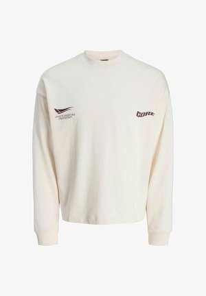 Cremefarbener Sweatshirt mit langen Ärmeln und rundem Halsausschnitt. Mit der Aufschrift "ATHLETIC ESSENTIALS CREATIVE DEPT." und "CORE" in Braun bedruckt.