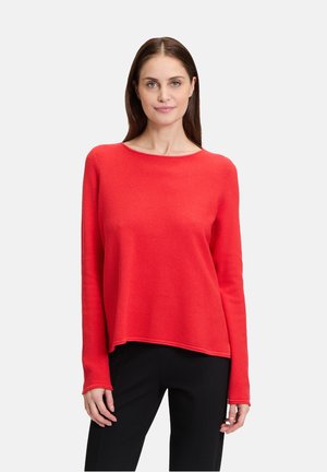 Roter Pullover mit langen Ärmeln und rundem Ausschnitt sowie rippenstruktur, in lockerem Schnitt, der bis zu den Hüften reicht.
