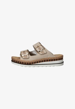 Beige slide sandal with two metallic buckle accents, cork and striped wedge sole, textured footbed, white rubber outsole, and casual design.