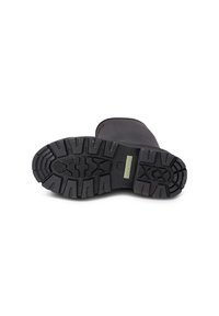 Semelle de botte noire en caoutchouc avec des profondes rainures, dotée d'une étiquette verte portant la mention "WODEN". Dessus lisse, design de toe arrondi, construction robuste.