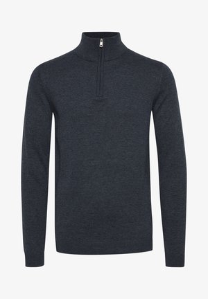 Tmavě šedý svetr s vysokým límcem a předním zipem. Hladké manžety a lem. Vyrobeno z měkké, strukturované tkaniny.