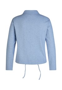 Light blue long-sleeve jacket made of a textured fabric, featuring a collar and adjustable ties at the waist. Simple and modern design.