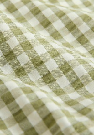 Green and white checkered fabric with a soft texture, featuring a classic gingham pattern. The squares are evenly sized and woven.