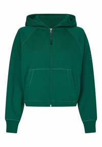 Haut à fermeture éclair vert en tissu doux, doté d'une capuche, de deux poches avant et de détails de couture contrastés. Longueur courte.