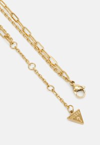 Guess ALL YOU NEED IS LOVE złoty