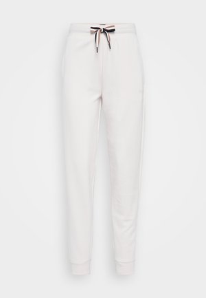Calças de jogging brancas em algodão com um corte ajustado, apresentando uma cintura larga e um cordão multicolorido na cintura.