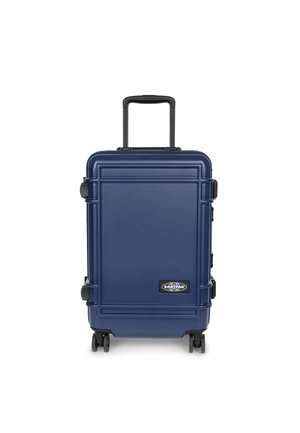 Navy hard-shell suitcase with a textured finish, retractable handle, and four wheels; features logo on front and sturdy latches on sides.