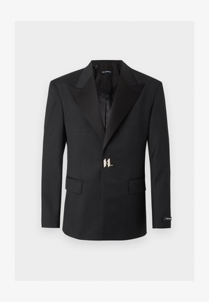 Czarna, dopasowana marynarka z szerokimi klapami, dwoma przednimi kieszeniami z patkami oraz srebrnym zapięciem w formie logo KL na środku.