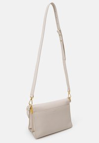 Coccinelle BINXIE - Handbag - white