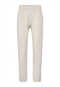 Cream-colored relaxed-fit pants made of soft fabric, featuring an elastic waistband and tapered cuffs at the ankles.