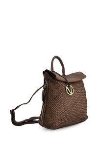Brown woven leather backpack with a smooth, tan flap, gold hardware, a round logo accent, and adjustable shoulder straps.