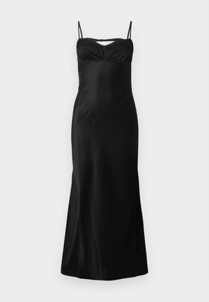 Vestido negro ajustado con tirantes finos, con un escote fruncido y tela suave y fluida. De largo midi con un ligero vuelo en el dobladillo.