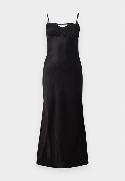 Vestido negro ajustado con tirantes finos, con un escote fruncido y tela suave y fluida. De largo midi con un ligero vuelo en el dobladillo.