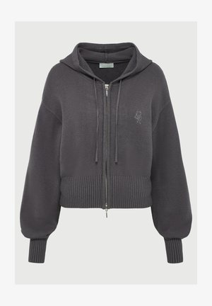 Tumehallist lõngast kootud tõmblukkuga kapuutsiga jakki, millel on pikad puffed varrukad, soonikkoes mansetid ja äär, esipoolse reguleeritava nööriga ja diskreetne broderitud logo rinnal.